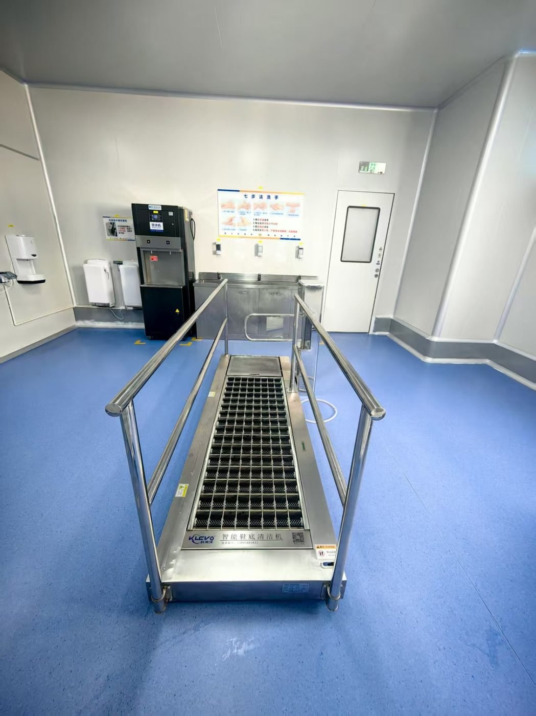 Klevo LS series track-type shoe sole cleaning machine installed in a cleanroom gowning area